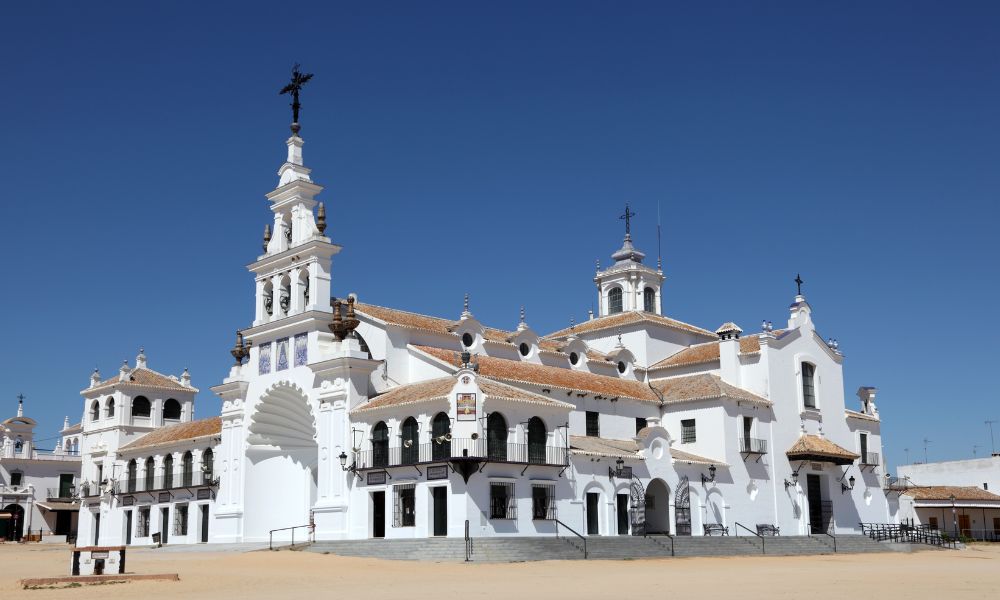 Ilustración de la peregrinación a El Rocío, mostrando devotos en Andalucía