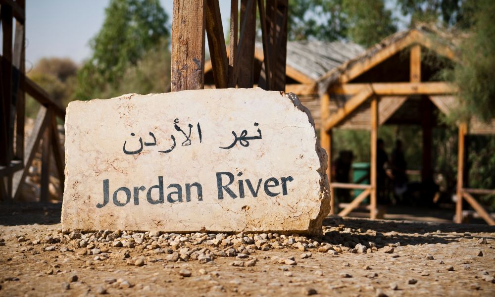 Illustration of biblical miracles happening at the Jordan River.